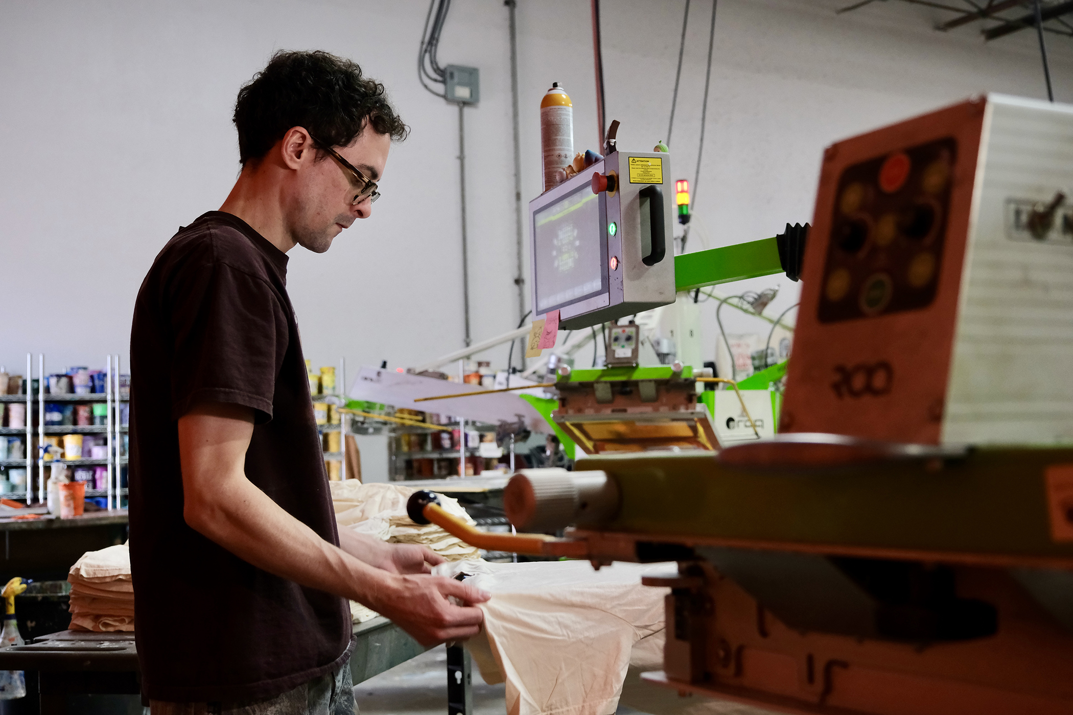 Man preparing a t-shirt for printing