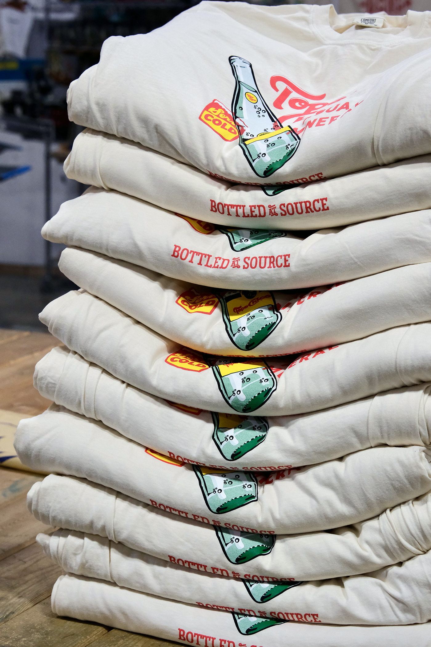 Pile of printed t-shirts by Kong Screenprinting